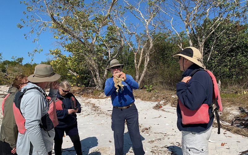 Everglades Area Tours guide with guests on island beach