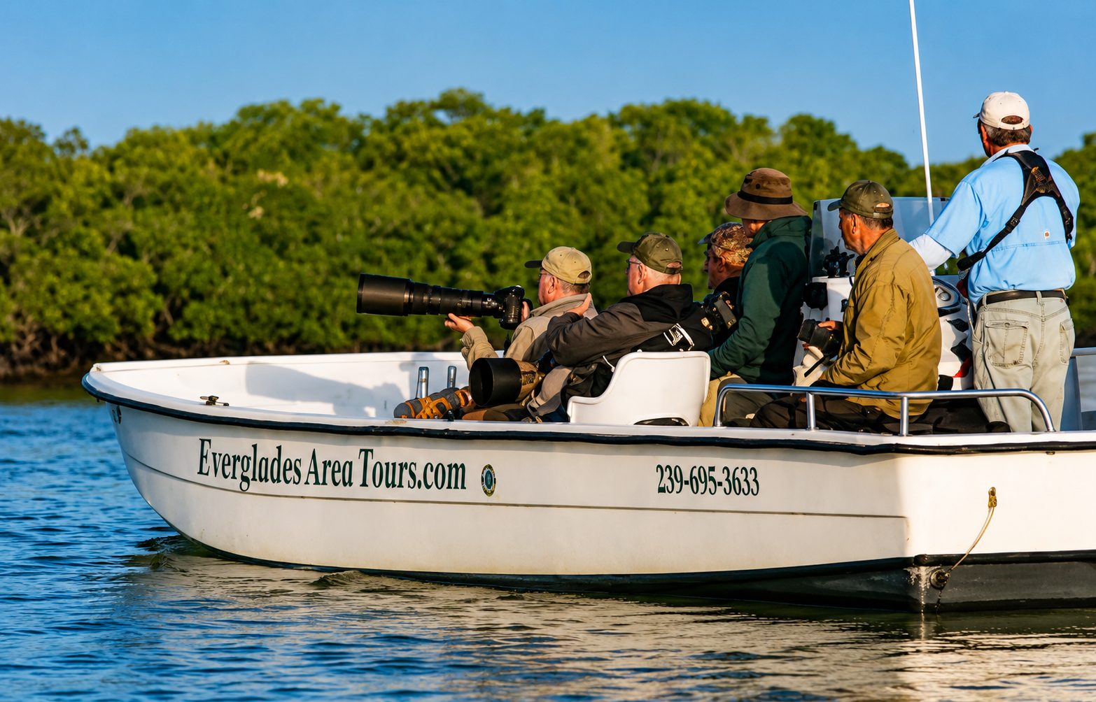 Guest photographing wildlife on Everglades hiking eco tour